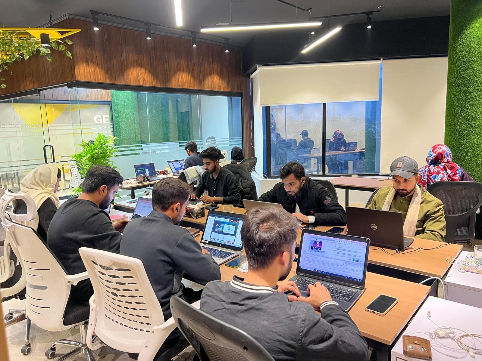 The Convertt team collaborating around a table